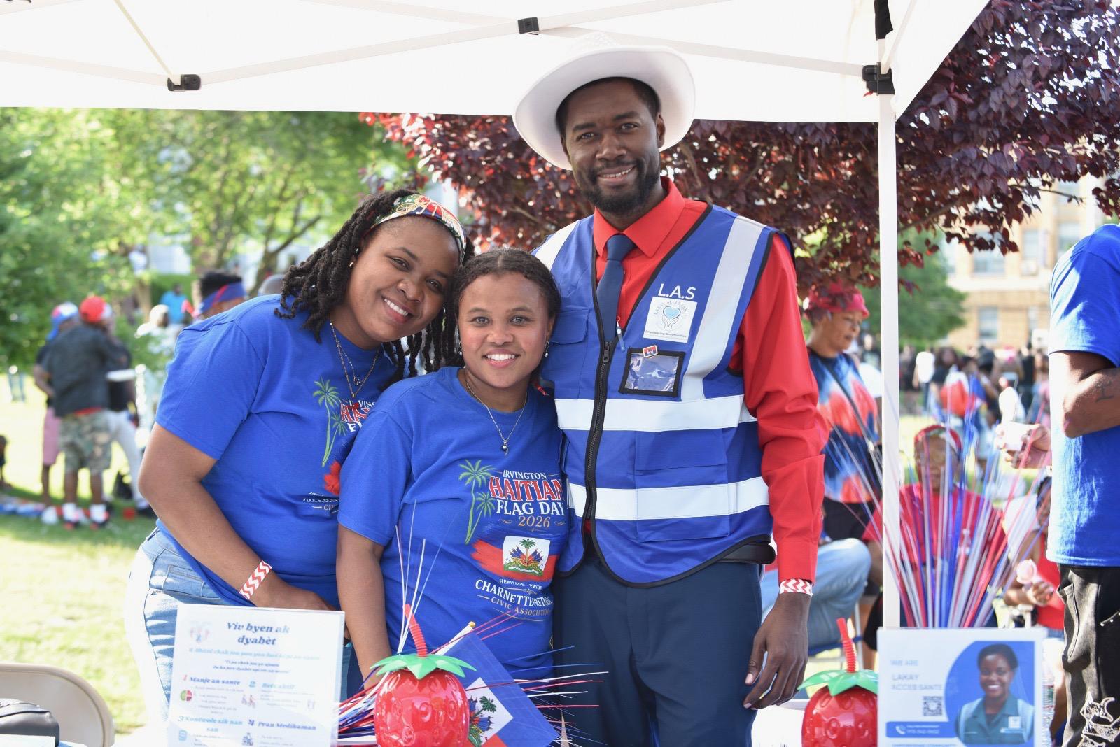 Dr. Lukenson Francois and Dr. Charnette Frederic at the Lakay Accès Santé outreach table, Haitian Flag Day 2026